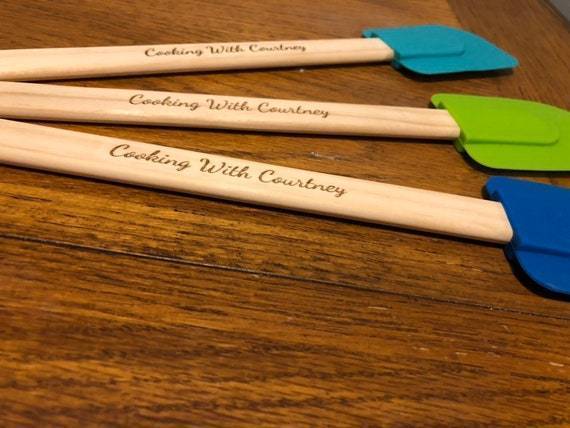 "Custom engraved wooden handle spatula with silicone end."