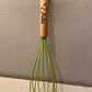 Engraved bamboo and silicone whisk for baking enthusiasts